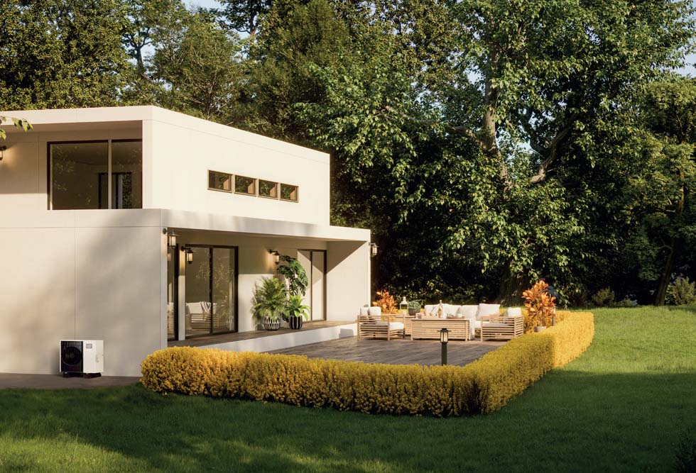 Maison moderne avec jardin et terrasse entouré de buisson